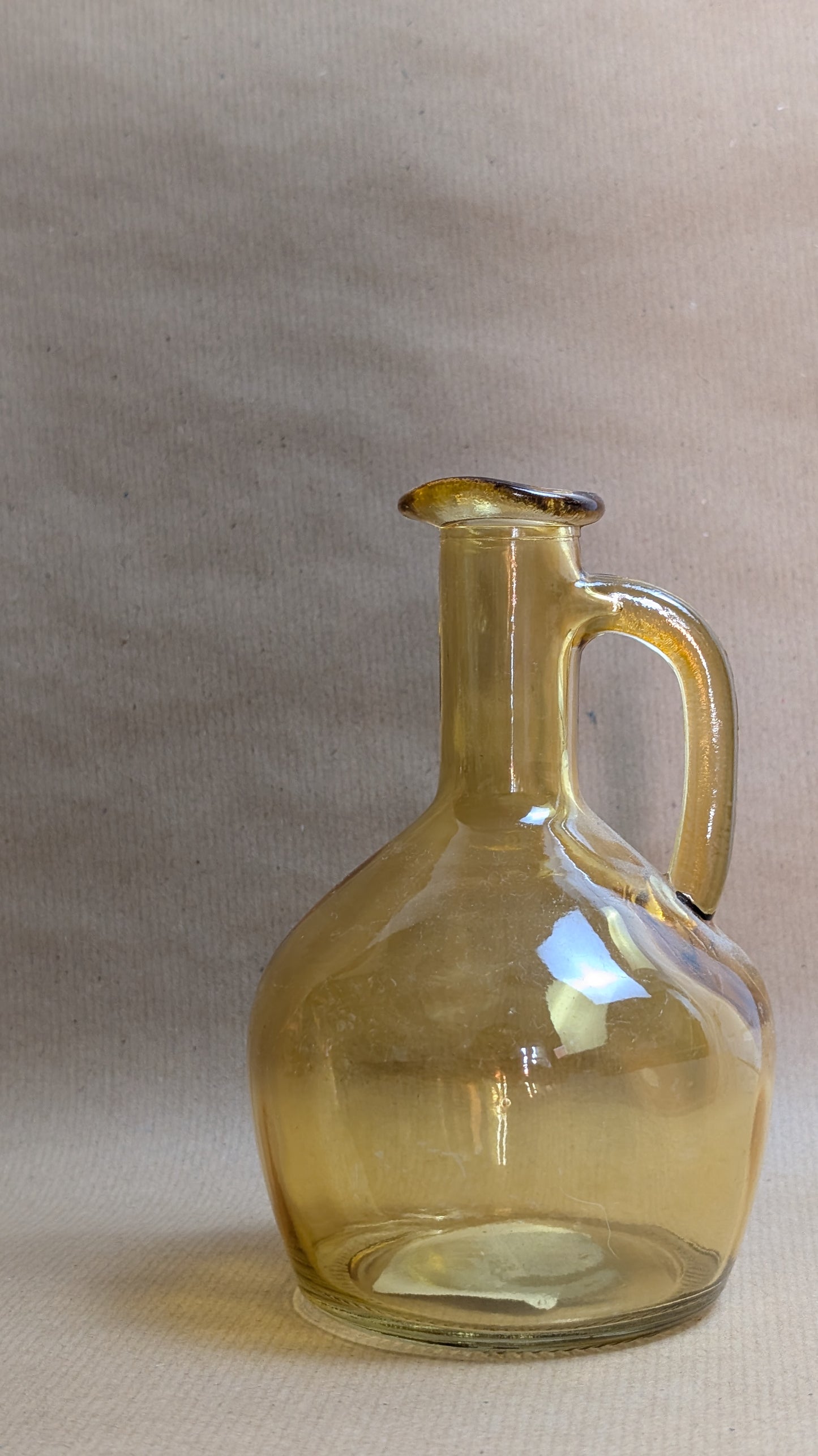 Yellow vase with green bouquet